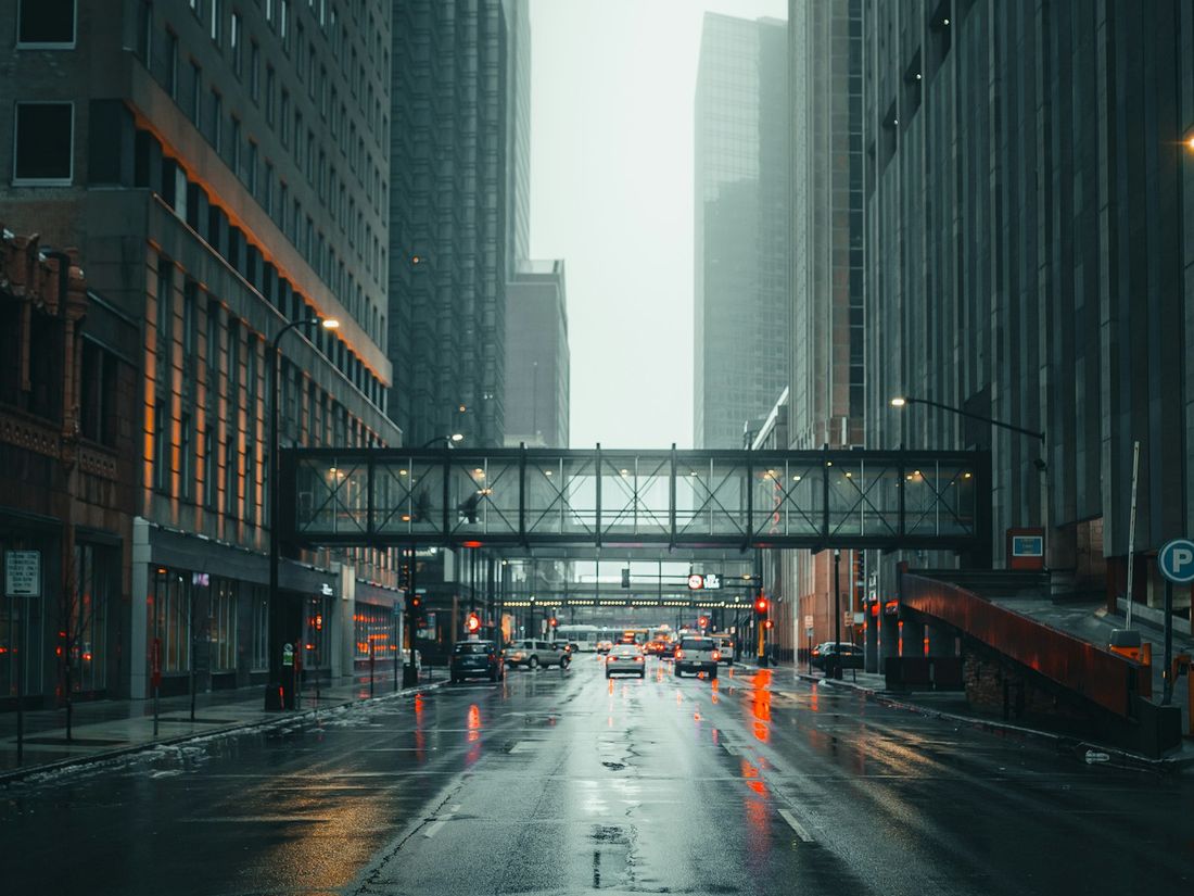 A grey, rain-soaked city street on a miserable day.